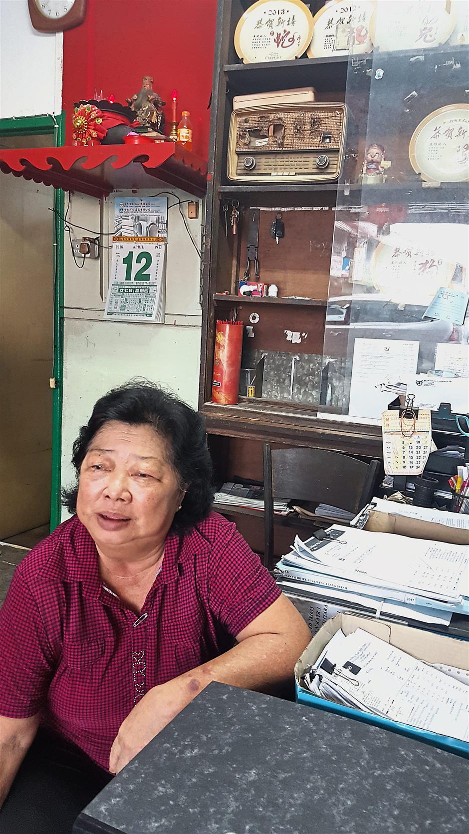 Tan says her father-in-law started a family business making metal containers at one of the pre-war shops in the new village.