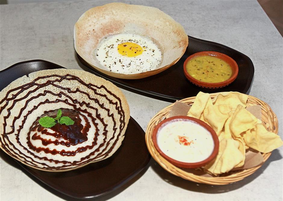 Egg Appe (top) and Nutella Appe (bottom). The restaurant’s appe, which is Sri Lanka’s version of appam using coconut water and rice flour, come in both savoury and sweet forms.