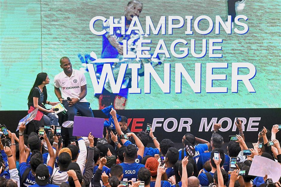 Still a crowd-puller: Chelsea legend Didier Drogba at a meet-the-fans session at Sunway Pyramid on Saturday. — Bernama