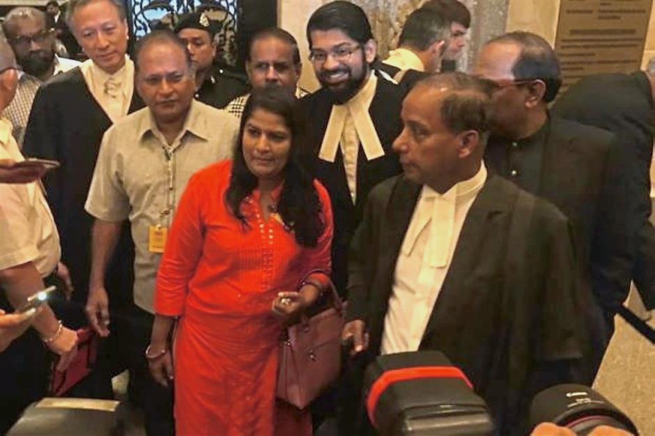 Victorious: Indira with her team of lawyers including (second left) Philip Koh and Kulasegaran (front, right).