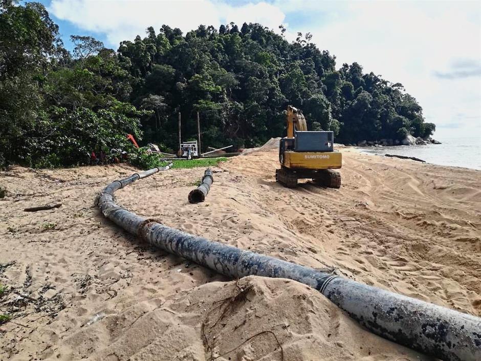 An excavator and pipe located near the ?estuary?.