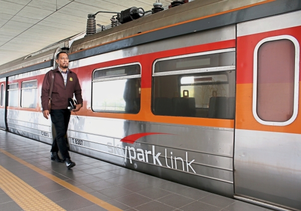 Muhammad Shahidul has the coach to himself as he travels from KL Sentral to Skypark Terminal. — Photos: Nur Athirah Farhana Pawzi/The Star