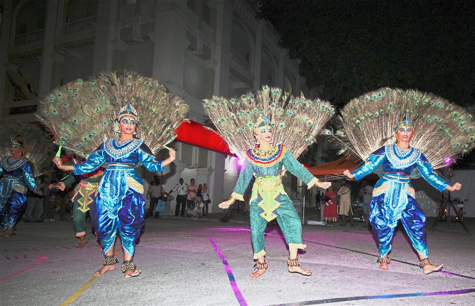 Indian traditional dancers performing a peacock dance at the event in Ipoh.