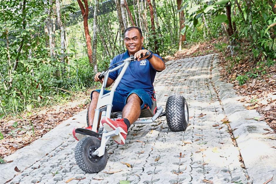 Afzainizam tests a downhill cart, which visitors will use to zoom downhill on a 600m track in Gravityplay, ESCAPE’s next phase, which will be ready by year-end. Photo supplied by ESCAPE.