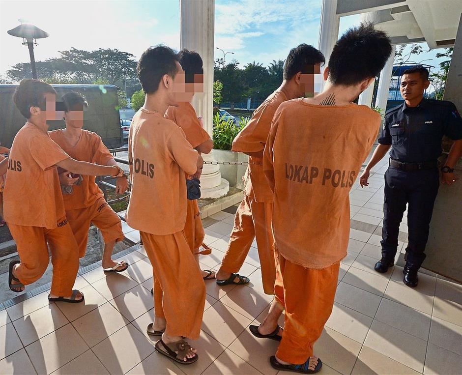 Serious offence: The six being brought to the Sepang court to be charged with drug trafficking.