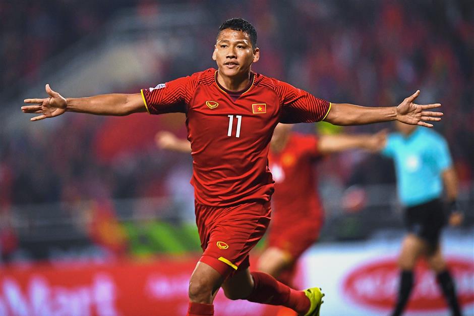 Vietnam’s forward after making the first goal for Vietnam during the AFF Suzuki Cup 2018 final football match between Vietnam and Malaysia at the My Dinh Stadium in Hanoi on December 15, 2018. (Photo by Manan VATSYAYANA / AFP)