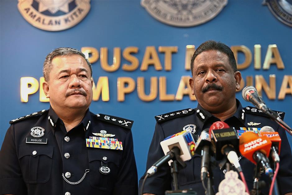 Comm Thaiveegan (right) with state deputy police chief Deputy Comm Datuk Roslee Chik speaking to reporters at the police headquarters in Penang.