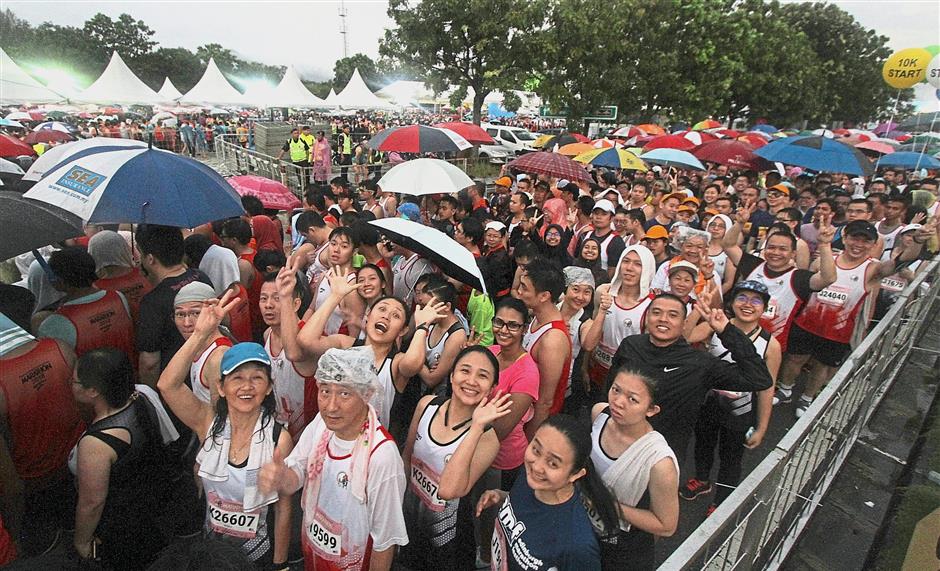 Runners queuing up to collect their medals.