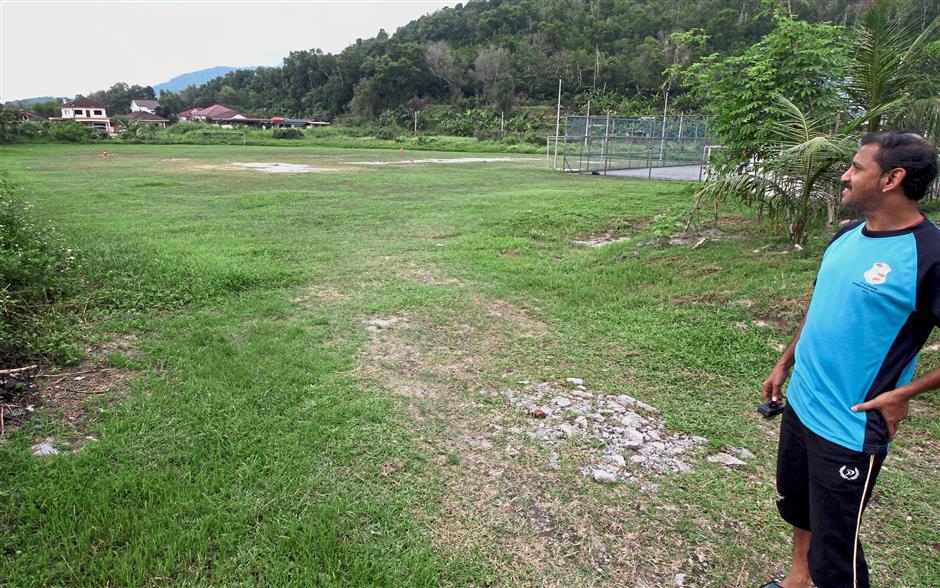 Kampung Jelapang Tambahan resident R. Visveswara is proud of the clean community field.