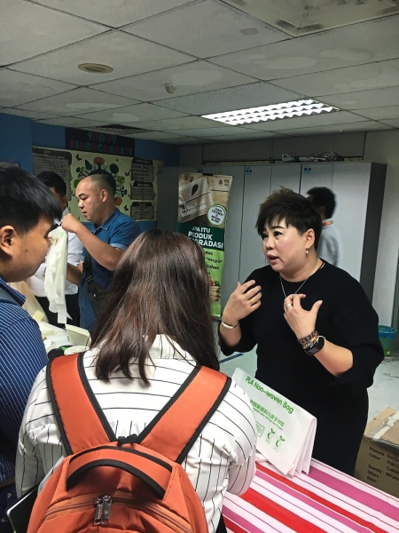 Sai (right) says traders should be aware of fake biodegradable plastic bags.