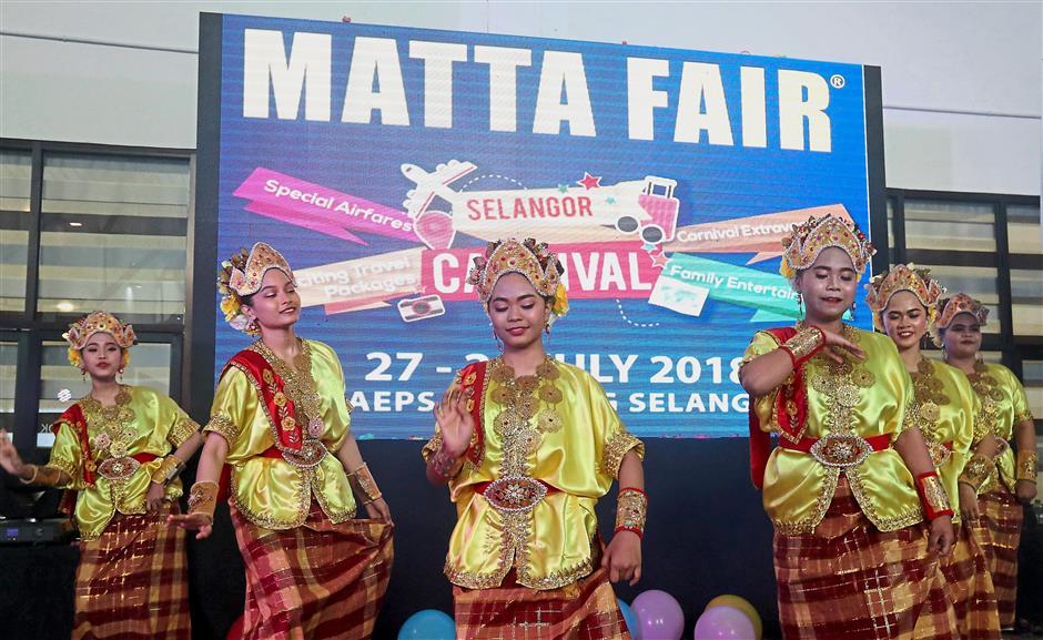 Cultural dancers performing during the launch of the MATTA Fair Selangor Carnival 2018 at MAEPS in Serdang. — Photos: AZHAR MAHFOF/The Star
