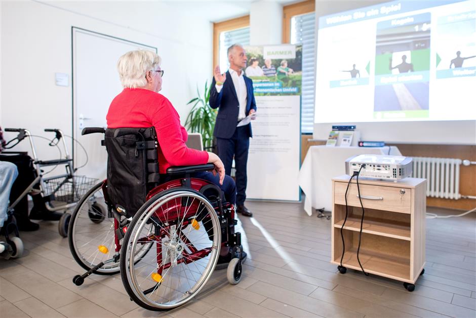 Residents in a German home for the elderly are testing out a new therepeutic console called the MemoreBox, aimed at improving memory and mobility. Photo: Hauke-Christian Dittrich/dpa