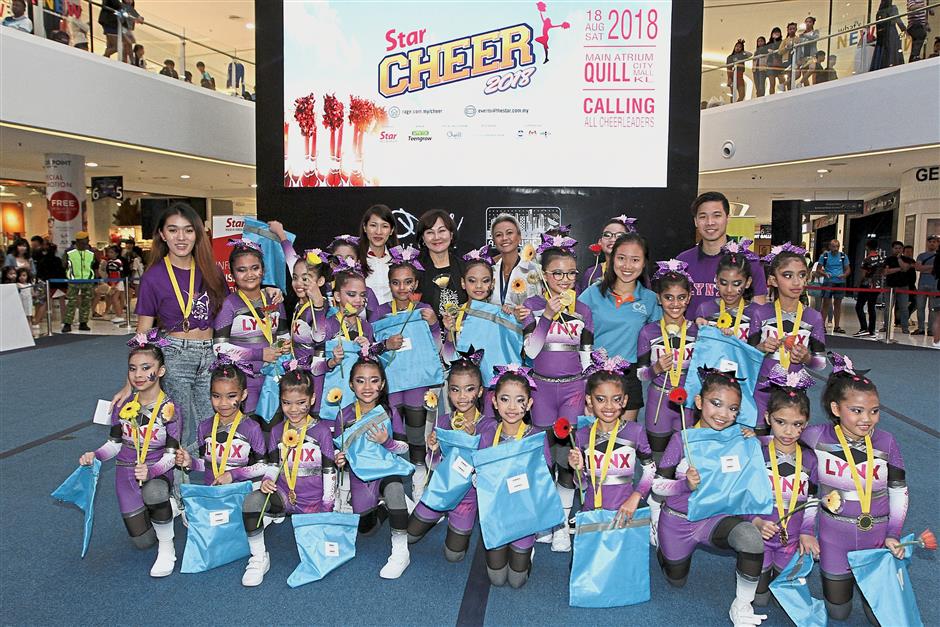 Little Lynx from SK Bukit Damansara took top prize in the first Pee Wee Team Level 1 category for primary schools. With them are (back row from left) Star Media Group Events assistant general manager Corinne Chieng, chief special projects officer June Wong and Advertising and Business Development manager Lina Ismail.