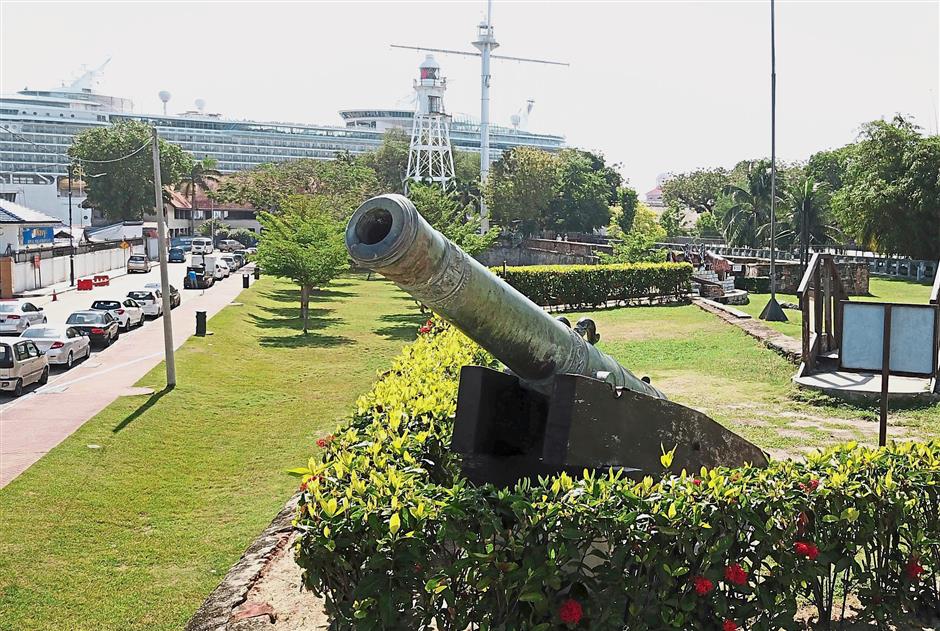 A bronze cannon which has a green coating on the outer surface to protect it against harsh weather is on display at Fort Cornwallis. — Photos: ZAINUDIN AHAD and ASRI ABDUL GHANI/The Star