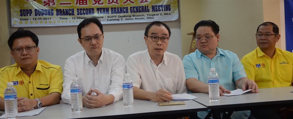 Wong (centre) speaking at the press conference with Kuok on hisleft and Lau on his right.