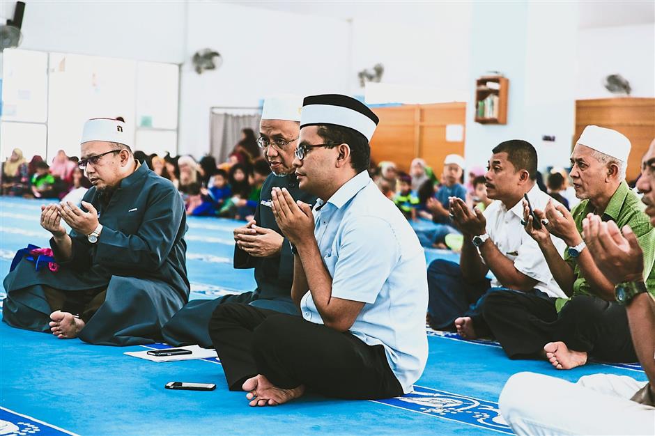 Humble: Akmal, who does not like to talk too much about his decisive election victory, says a prayer at the Taman Dato’ Onn mosque.