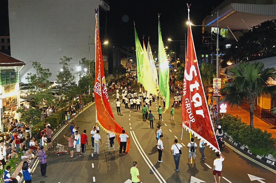 Giant flags are among the main highlights of the procession.