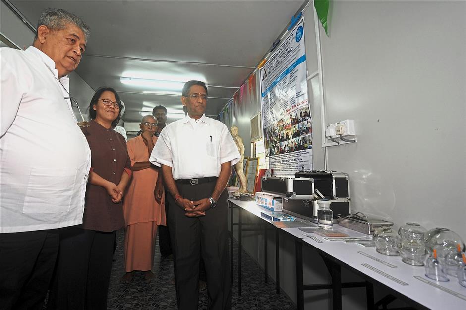 Better tools: ?Subramaniam (?right) with Dr K. Devi (?left) ?examining the newinstrument?s at the Integrated Holistic Therapy Centre.