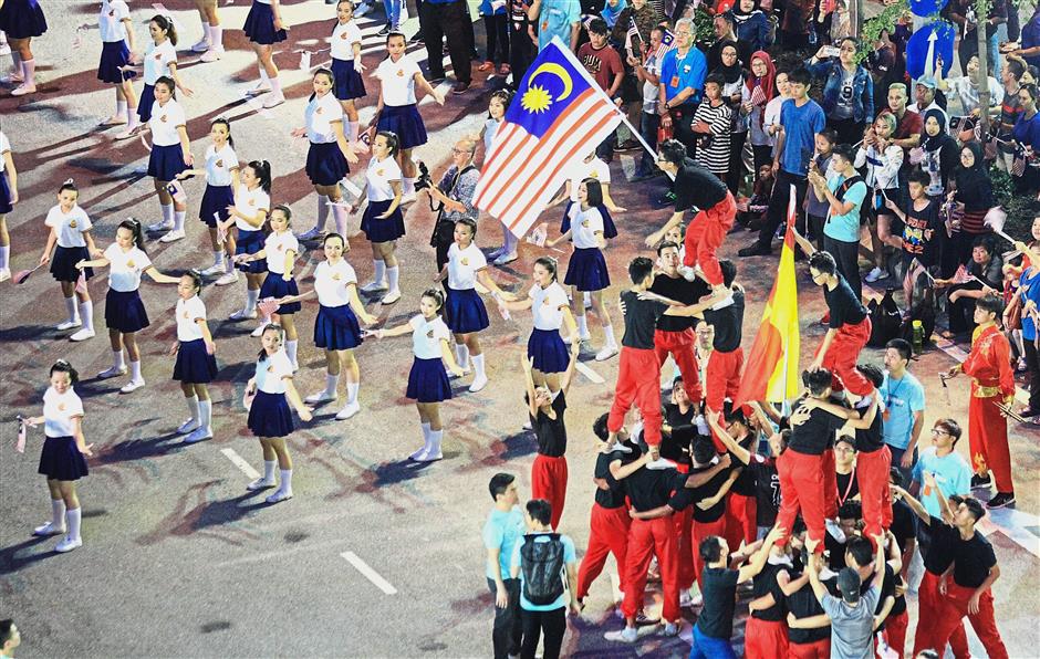The crowd being treated to a parade involving 300 participants from Soka Gakkai Malaysia during the countdown celebration. — Photos: MUHAMAD SHAHRIL ROSLI /The Star