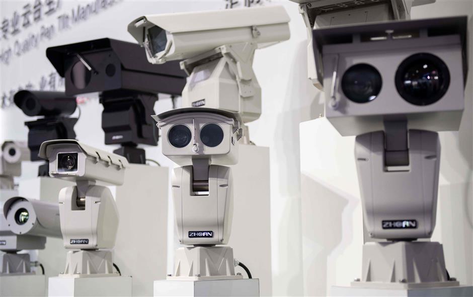 AI (Artificial Inteligence) security cameras using facial recognition technology are displayed at the 14th China International Exhibition on Public Safety and Security at the China International Exhibition Center in Beijing on October 24, 2018. (Photo by NICOLAS ASFOURI / AFP)