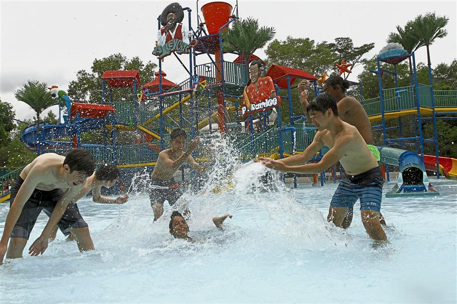 On these slides called Speed Racer, you can race with your friends and zoom down at 45kmph in Escape Waterplay. (Right pic) Children having fun at the Play House in the theme park. — Photos: LIM BENG TATT/The Star