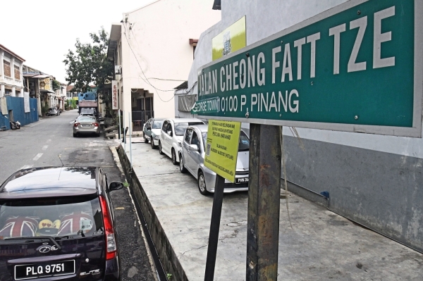 Residents of Jalan Cheong Fatt Tze still call it by its former name, Hong Kong Street.